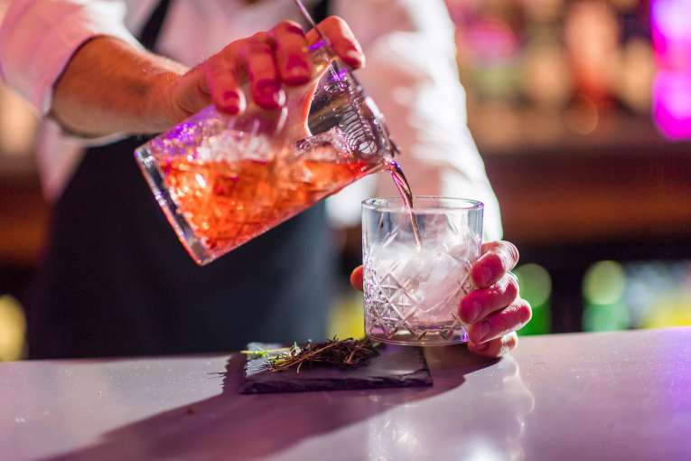 Royal and Fortescue Hotel Bar 62 Bartender Making Smoking Cocktail